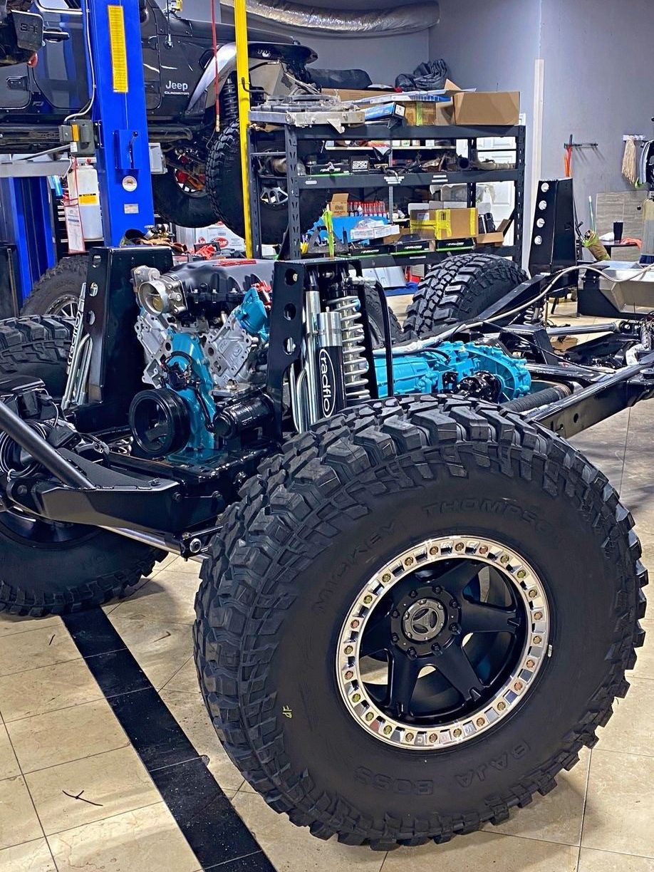 A beadlock wheel and tire going onto a build in the shop