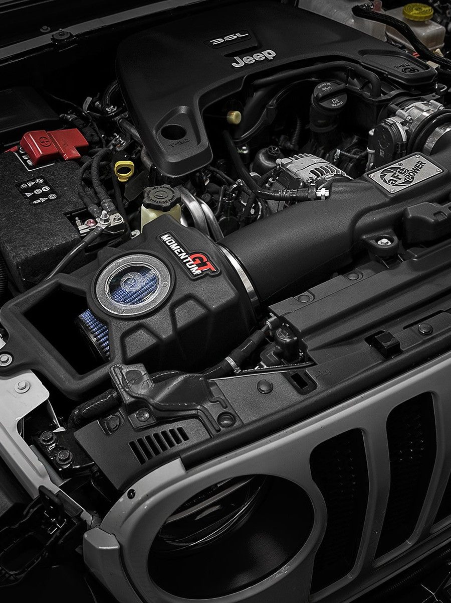 Engine-bay work on a build in the Elevation Jeeps shop