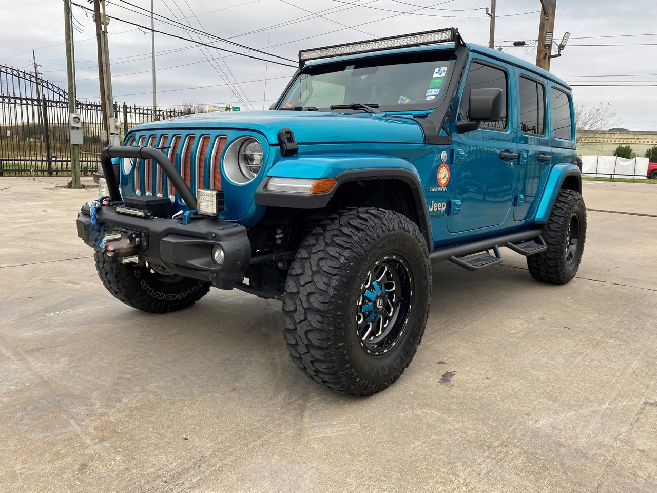 A teal Jeep Wrangler Rubicon build
