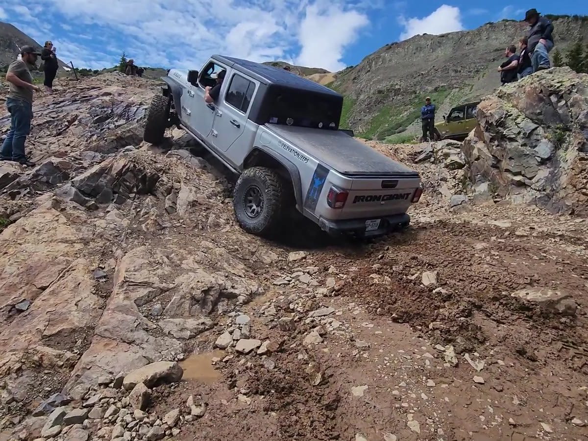 A Jeep climbing the rocks on a trail run