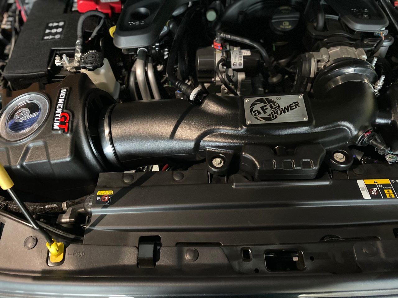 Engine-bay work on a Jeep build